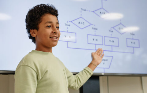 Boy Presenting in Coding Class